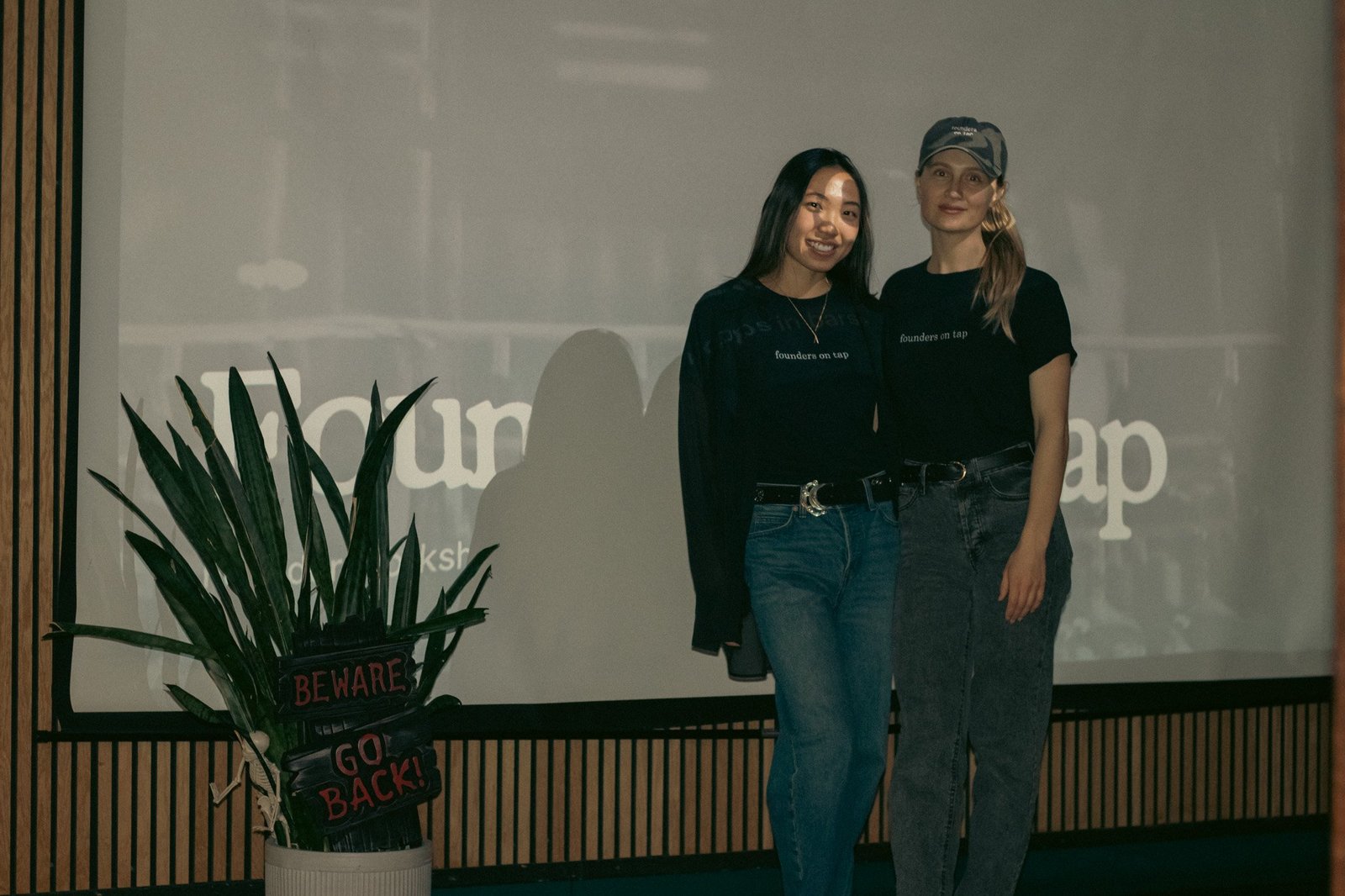 two hosts in front of the screen